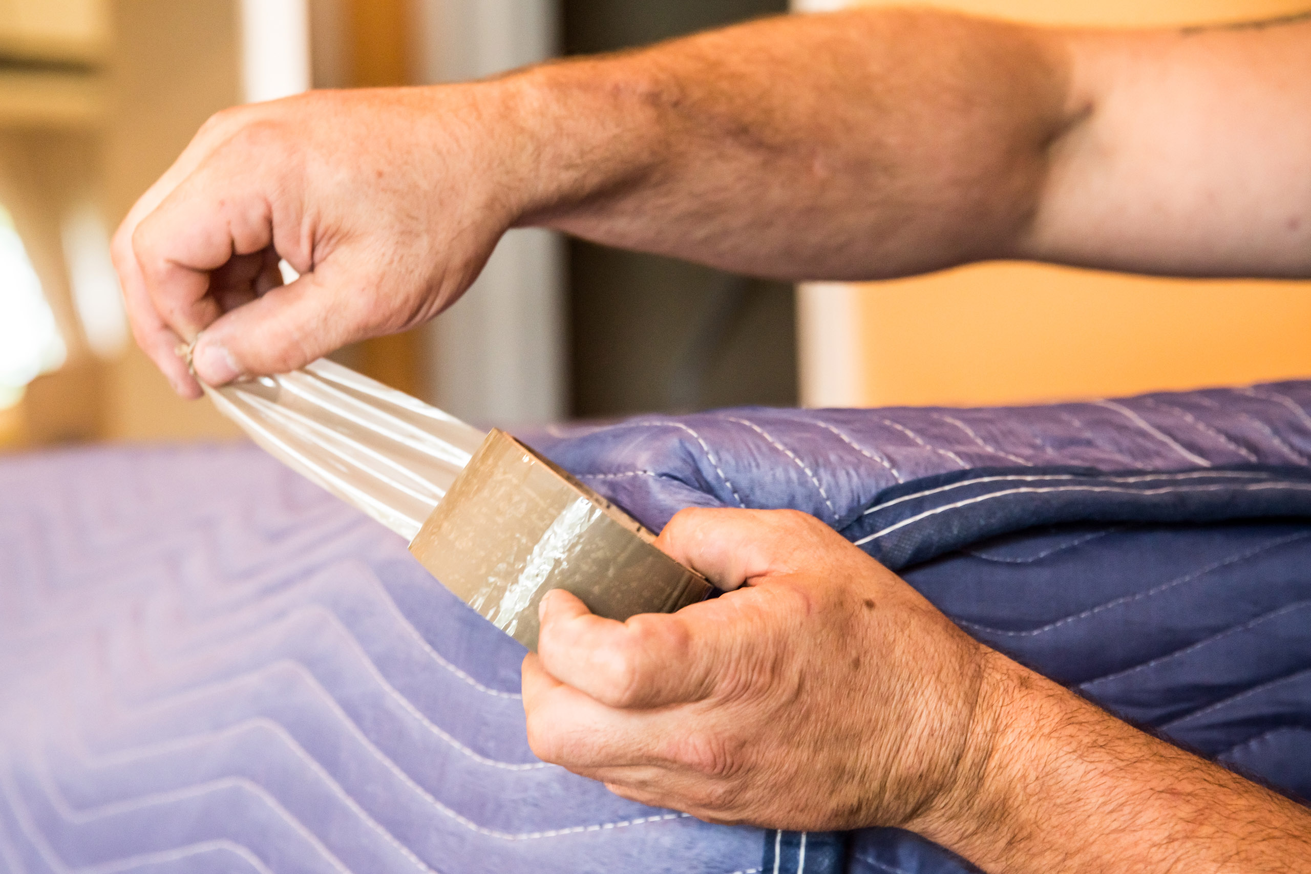 A package is being sealed by Rent-a-Son professional in Toronto